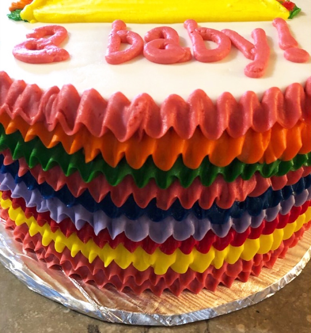 Rainbow ruffle gender-reveal cake