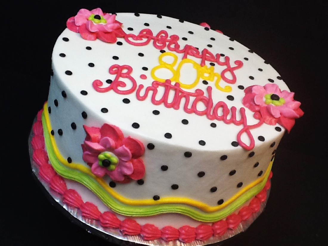 White polka-dot 30th birthday cake with pink flowers