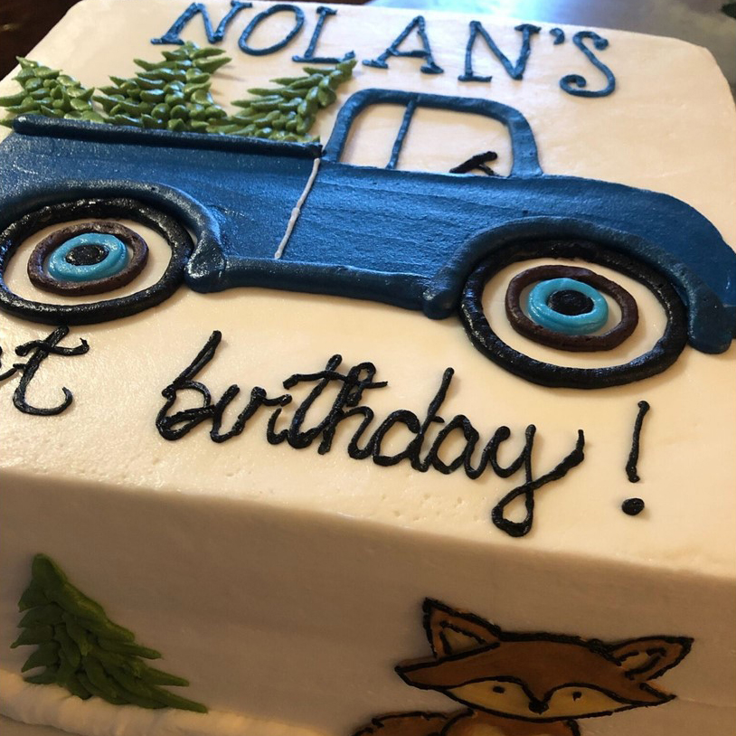 Hand-painted vintage-truck first-birthday cake